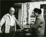 Photograph of Charles Burchfield and LaVerne George in his studio with The Woodpecker, 1955-196 ...