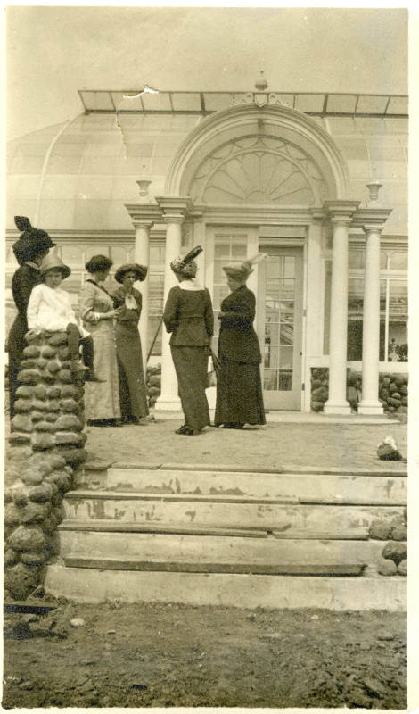 Nancy Reynolds with five women at entrance to Greenhouse