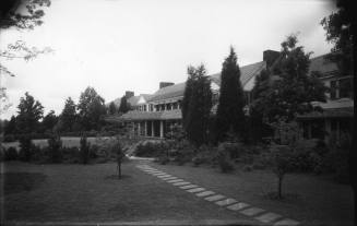 Front of house with automobile and slate walk