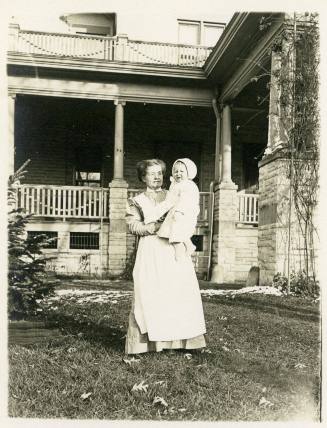 Unidentified nurse with Smith Reynolds at Fifth Street house.