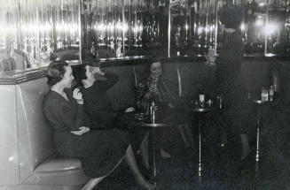 Mary Reynolds Babcock and friends in mirrored Art Deco bar