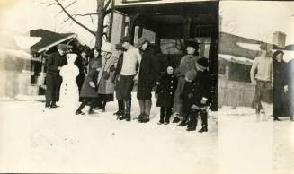 Mary, Nancy, and Dick Reynolds with others building snowman