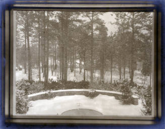 Snow-covered fountain and landscape from window in R. J. Reynolds' Study. 