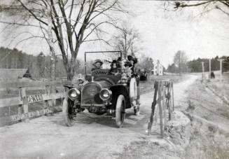 R.J. and  Katharine Reynolds among 6 people in automobile on unidentified road.