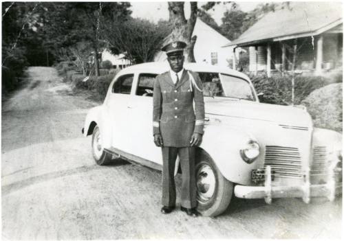 Sam Stimpson standing in Five Row, circa 1940
