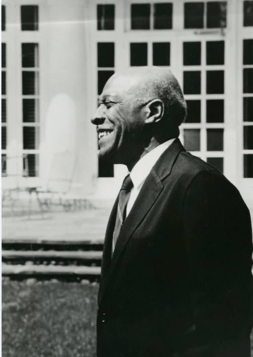 Harvey Miller in garden in front of sun porch, circa 1970