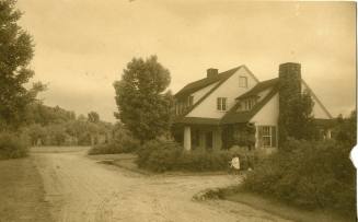Nadeina Gibson Buchanan in front of the Superintendent's cottage in Reynolda Village, circa 191 ...