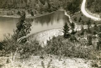 Mountainside view of lake with dam, circa 1935