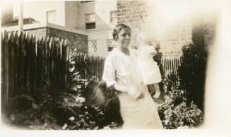 Marjorie Carter with one of the Babcock children as a baby, circa 1932
