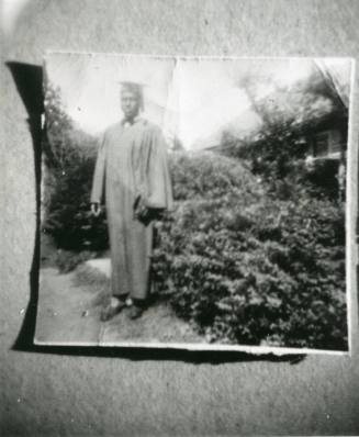Samuel Stimpson in graduation cap and gown, 1950